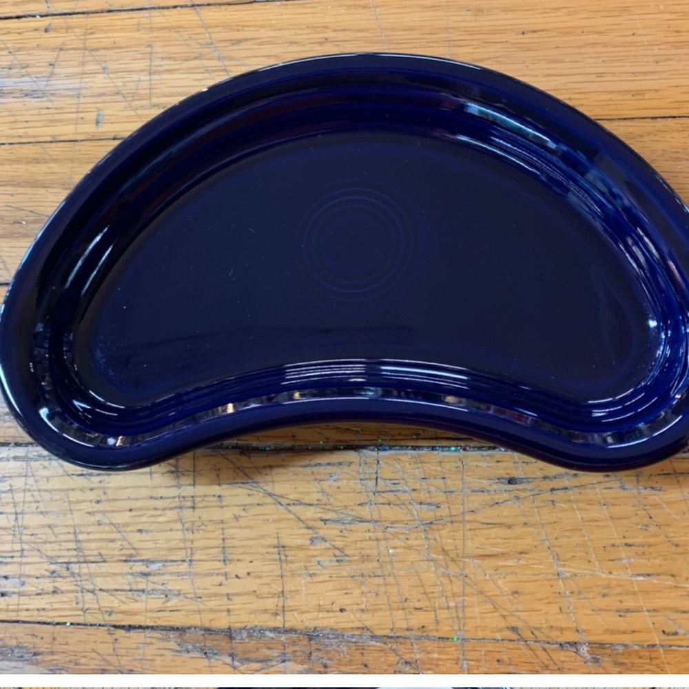 Three cobalt crescent plates.